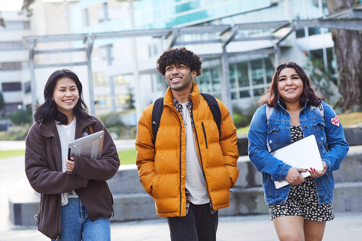 San Francisco State University, students walking with their laptops