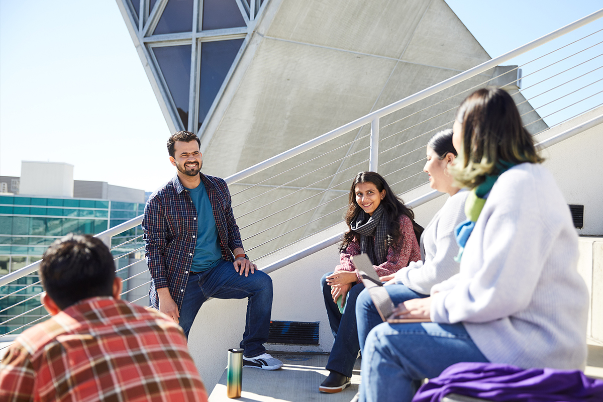 San Francisco State University, students discussing with their laptops outside