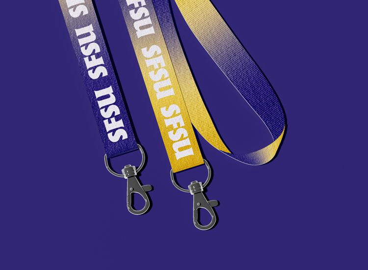 Two lanyards printed in SFSU color gradients with repeated monogram logos